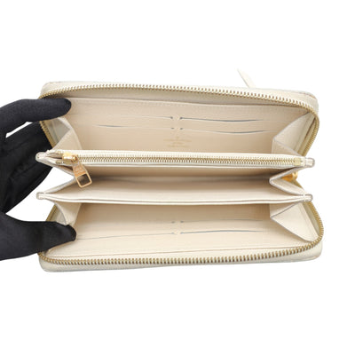 Louis Vuitton Monogram Empreinte Leather Zippy Wallet In Cream