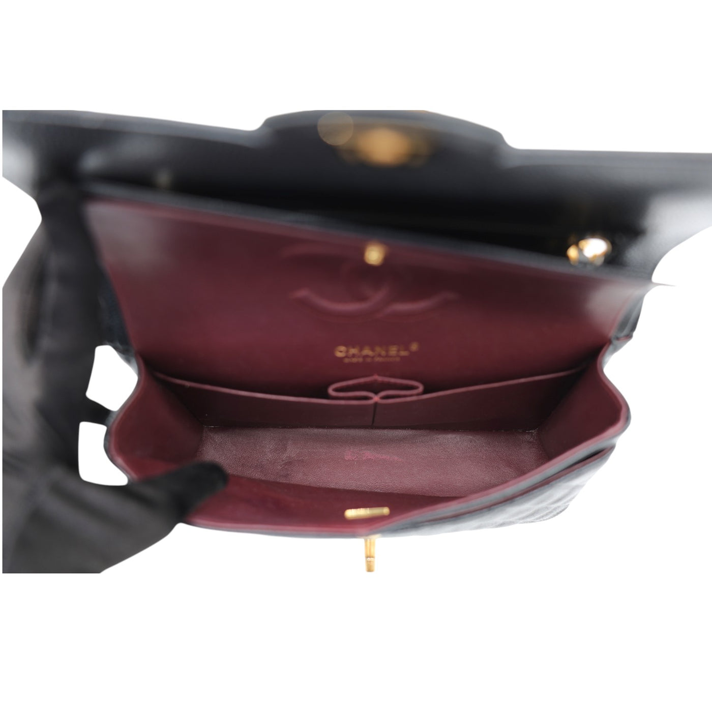 CHANEL Double Flap Medium Caviar Leather Bag In Black