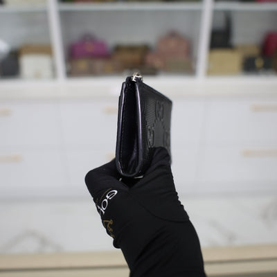 Gucci GG Embossed Leather Zip Around Wallet In Black