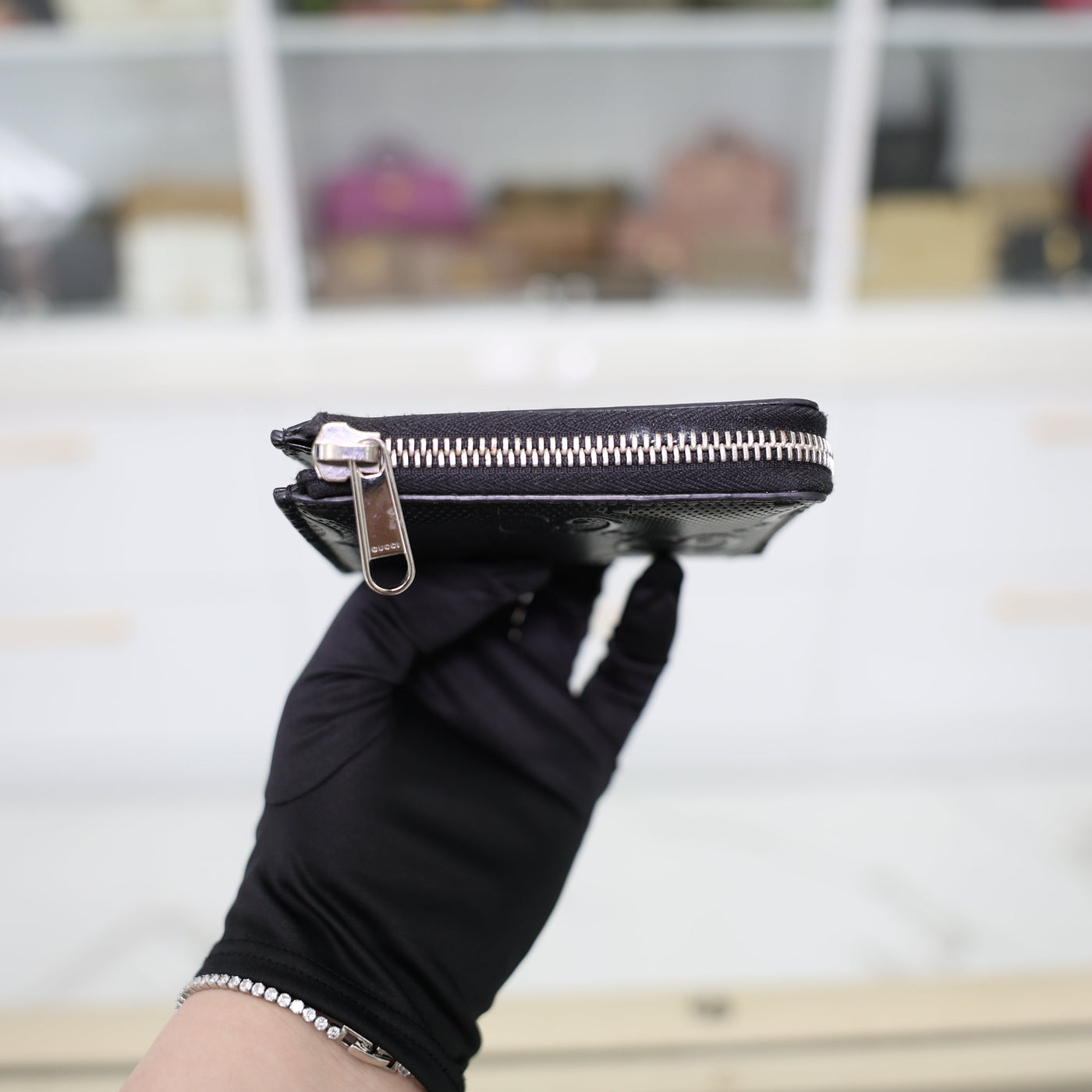 Gucci GG Embossed Leather Zip Around Wallet In Black